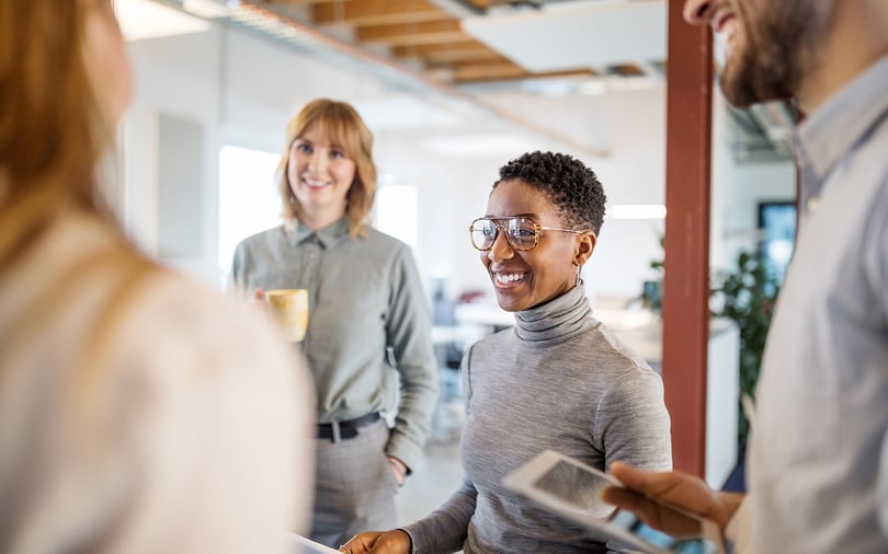 Multi-ethnic business team having a standing meeting in office