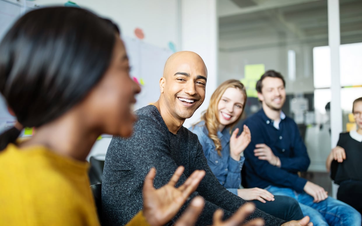 Business team talking and smiling during a meeting
