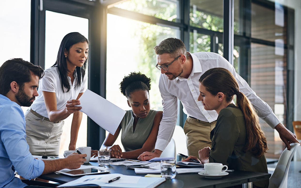 A group of businesspeople having a meeting in a boardroom