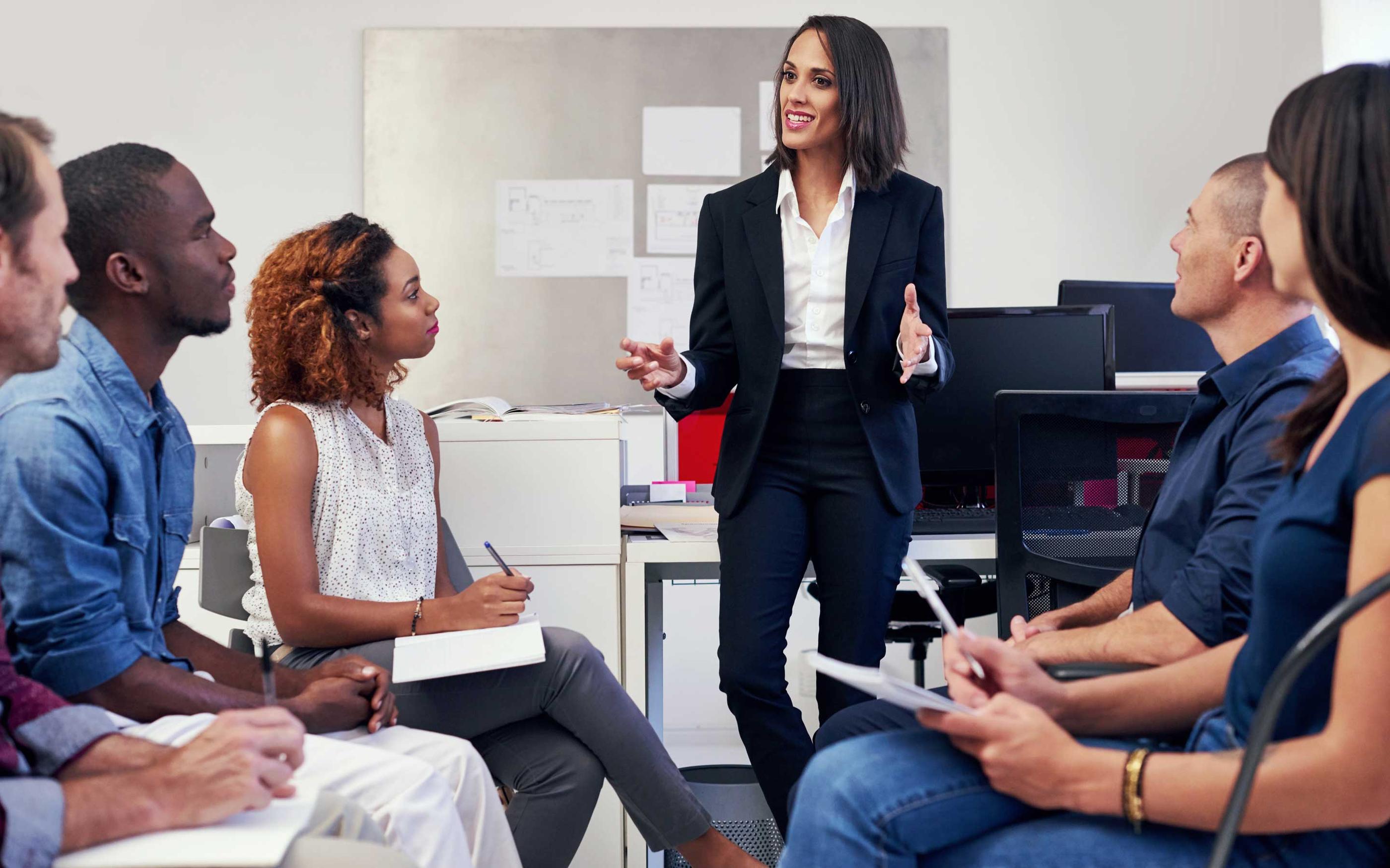 A group of office workers in a meeting