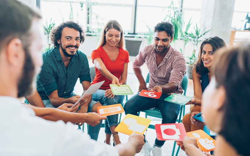 Group of people interacting with cue cards