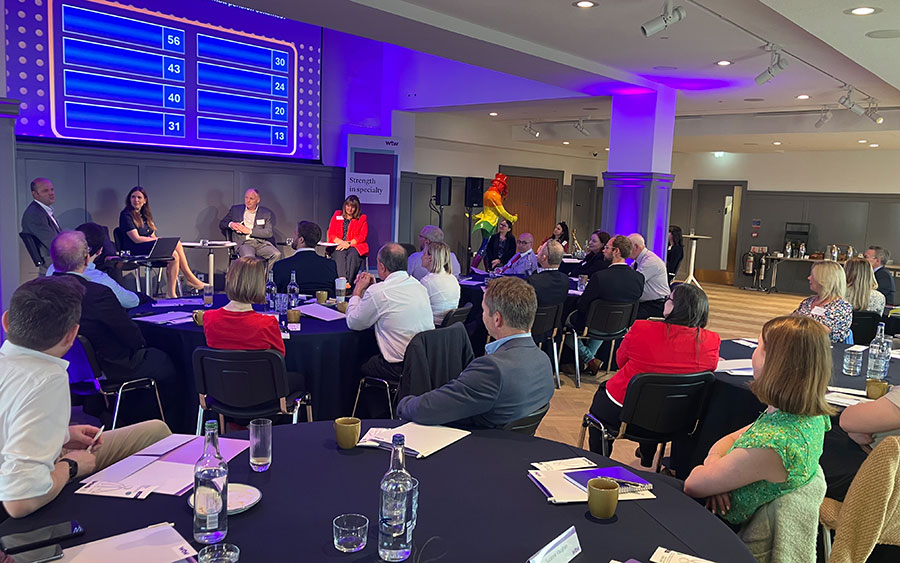 Paul Bernard asking the audience to guess the key priorities for smaller schemes.